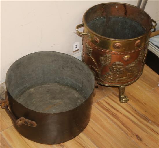 A copper and brass coal bin and a large pan